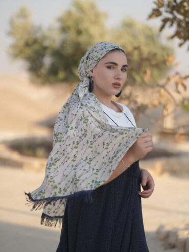 Long scarf in stone color with green flowers and navy fringes