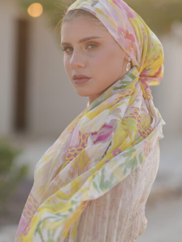 Long floral headwrap in shades of pink, yellow, and green